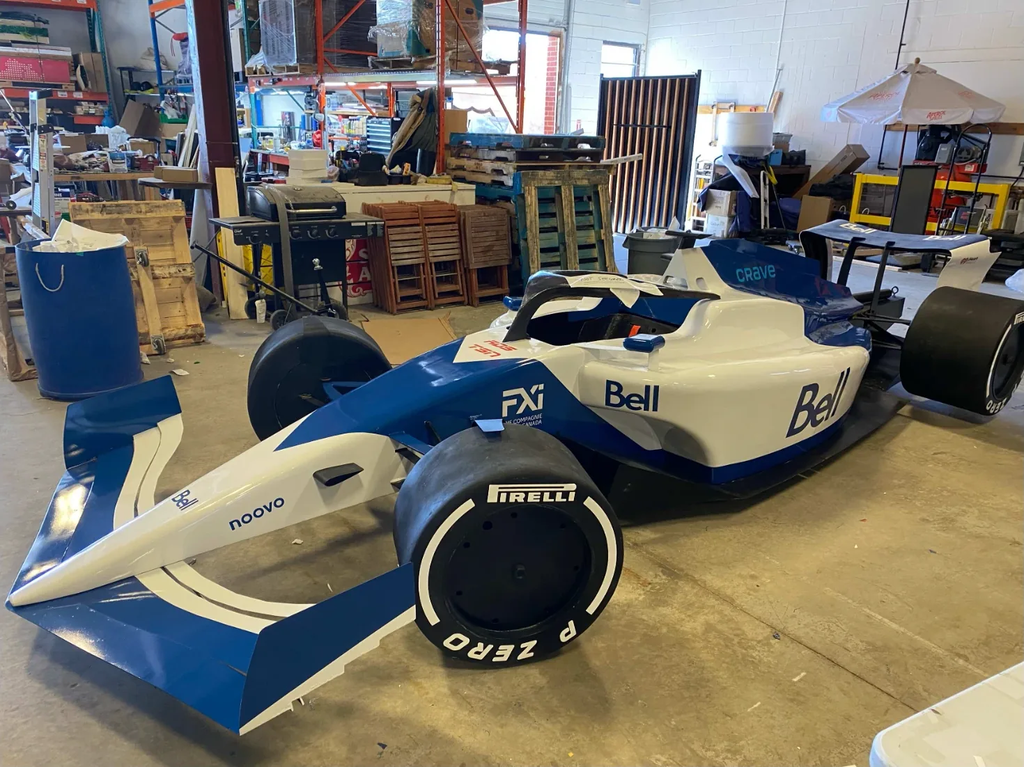 F1 replica wrapped in a white and blue Bell livery